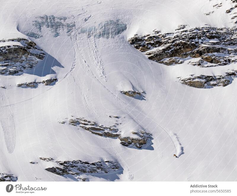 From above of anonymous Snowboarder in action enjoying vacation on snowy mountain in Zermatt Tourist Sport Mountain Slope Vacation Action Adventure Majestic