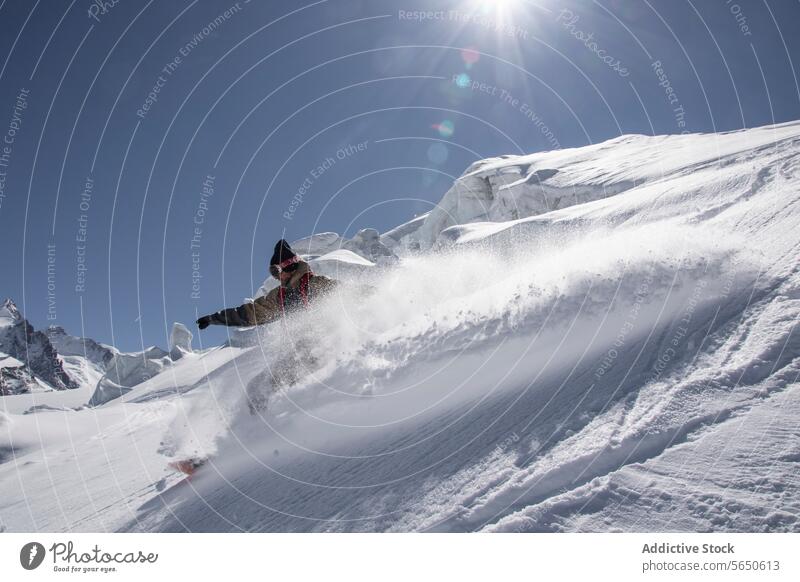 Snowboarder in action enjoying vacation on snowy mountain in Zermatt under blue sky Tourist Sport Mountain Slope Vacation Action Adventure Majestic Traveler