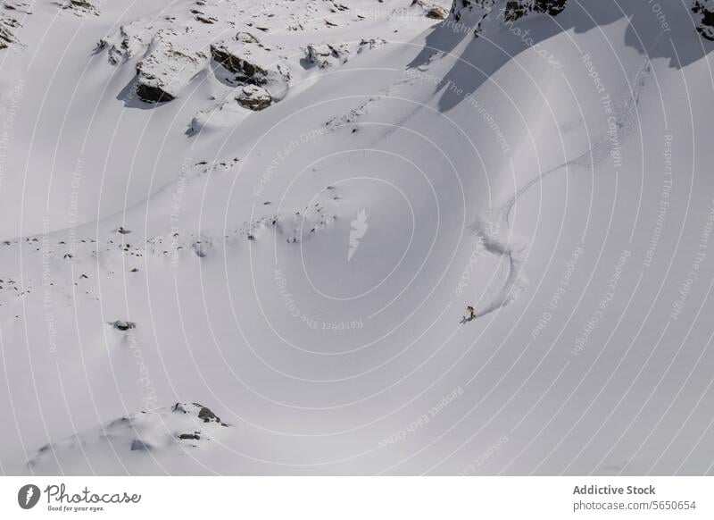 High angle of Anonymous man snowboarding on mountain on sunny day in Zermatt Tourist Snow Snowboard Sport Majestic Mountain Slope Landscape Picturesque Aerial