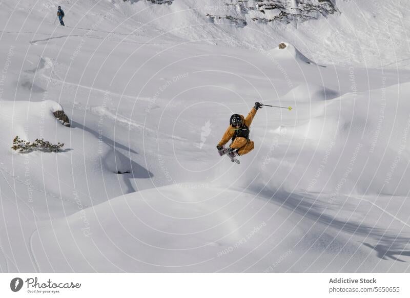 Anonymous Tourist in suit jumping with skis on mountain slope during vacation at Swiss Alps Skier Slope Snow Mountain Adventure Courage Motion Sport Extreme