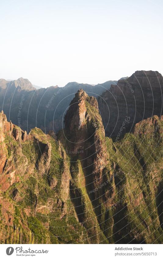 Idyllic view of mountain ranges with green plants and vegetation during sunrise landscape nature idyllic sunlight sky beautiful mountainous peaceful wilderness