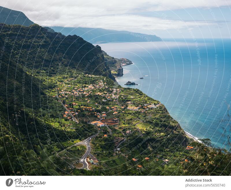 High angle of town with mountains and sea house sky plant tree green aerial view foothill cloudy nature scenic residential coastline travel landscape blue