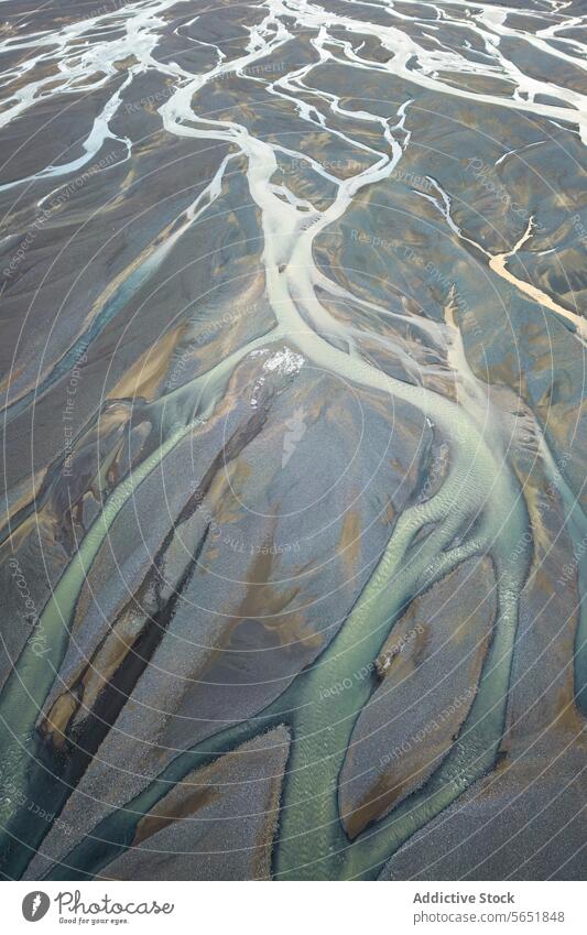 Braided Rivers Carving Through Icelandic Terrain aerial rivers braided highlands terrain landscape carving snaking nature waterways aerial view geography