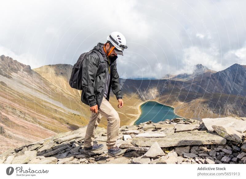 Hiker observing a crater lake at Nevado de Toluca, Mexico hiker nevado de toluca mexico mountain safety gear terrain ridge majestic serenity landscape outdoor