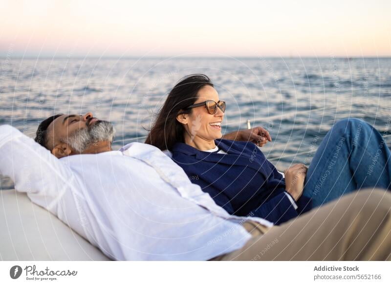 Happy couple relaxing on seaside trip love romantic smile enjoy happy travel traveler affection pleasure tourism fondness date tourist water optimist glad