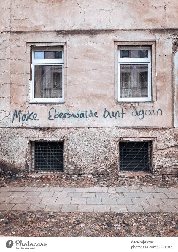 House wall with window and graffiti in Eberswalde real estate dwell Copy Space top Urbanization Copy Space right Copy Space left Copy Space bottom