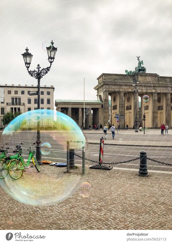 Brandenburgers and soap bubbles metropolis Freedom City Berlin center Panorama (View) Sunbeam urban Beautiful weather City life Sunlight Light