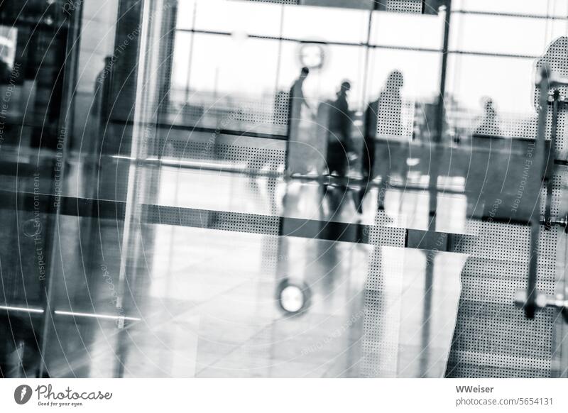 Small passengers run with their suitcases to one of the many gates of the large airport Airport Modern urban Passengers air passengers Flying Airplane travel