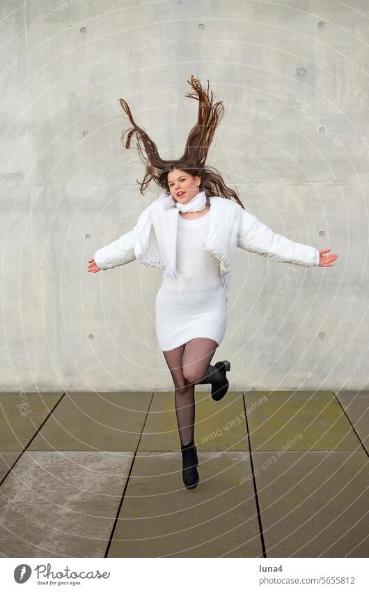 cheerful young woman with flowing hair Woman Laughter Young woman jump joyful leap Beauty & Beauty relaxed fortunate Happy Single Smiling Jump optimistic