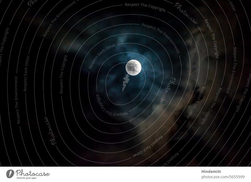 Silver, glittering moon between clouds Moon darkness Weather Moonlight Night Full  moon Night sky Moody Illuminate Exterior shot Mysterious Dark Sky Deserted