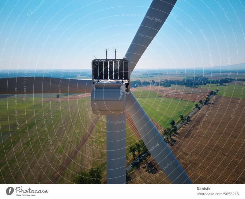 Aerial view of wind turbine in countryside area energy sustainable renewable generator windmill clean landscape green eco friendly field blades alternative farm