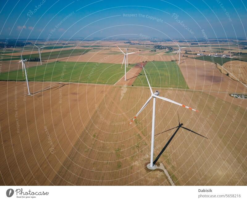 Aerial view of wind turbine in countryside area energy sustainable renewable generator windmill clean landscape green eco friendly field blades alternative farm