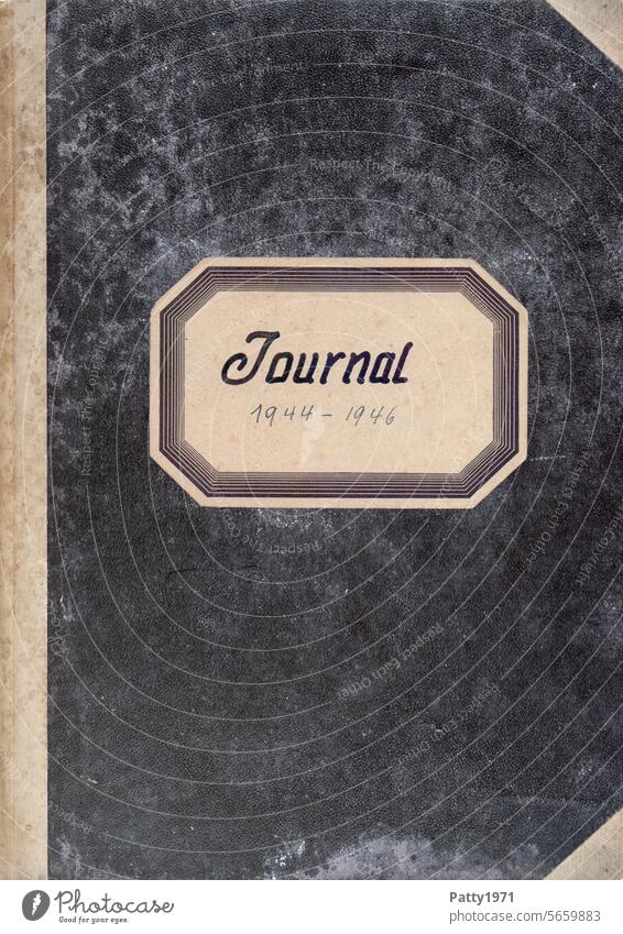 Front of an old cash book. The black cover is stained and shows signs of wear consistent with its age. Paper Diary Grunge blotchy vintage Second-hand Old