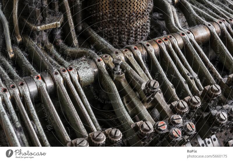 Detail of an old knitting machine. Machinery technique Mechanics Gear unit gearing pinion Chain sprocket chain wheel Wheel Gearwheel cogwheel country