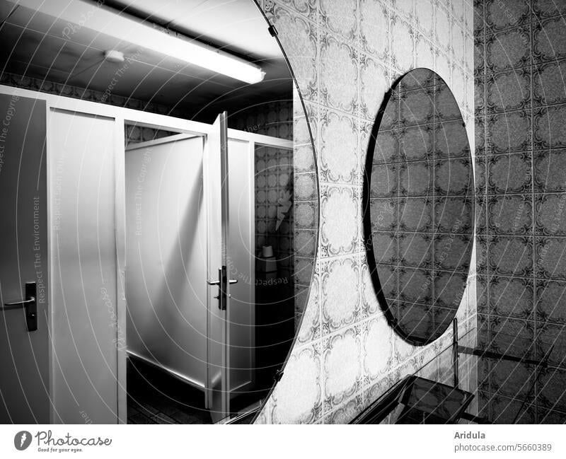 Toilet room with round mirrors b/w Mirror Round Sanitary facilities Retro Tile doors Toilet Cab Clean LAVATORY john hygiene Old Interior shot Bathroom Deserted