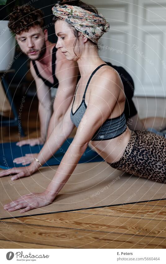 Personal trainer with a client in her living room during a workout personal trainer Customer customer Living room yoga mat Fitness mat Workout Yoga Healthy