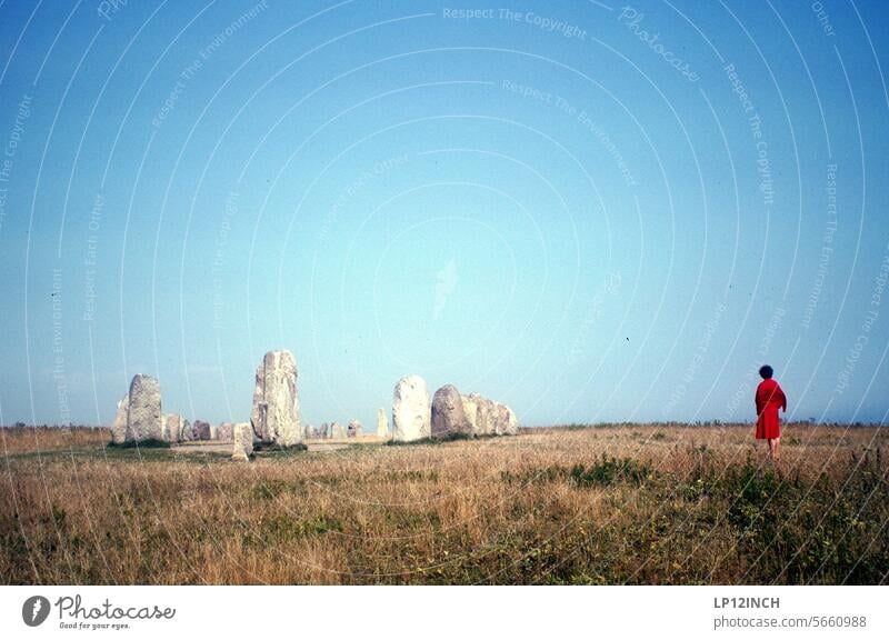 Times past VIII. Woman in red Stone circle Red vacation tourist Trip Destination Scandinavia Tourism Landscape travel Vacation & Travel Summer Analog