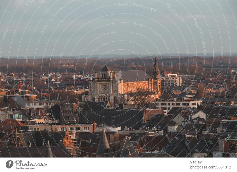 Watching the sunset over Ghent from the historic tower in the city centre. Romantic colours in the sky. Red light illuminating Ghent, Falnders region, Belgium