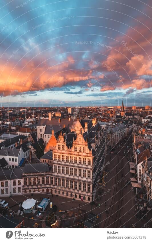 Watching the sunset over Ghent from the historic tower in the city centre. Romantic colours in the sky. Red light illuminating Ghent, Falnders region, Belgium