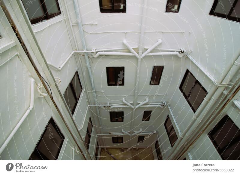 View down in the backyard, white buildings Building Apartment hotel Malta Backyard Downward Town Architecture Exterior shot Window Facade Rain gutter