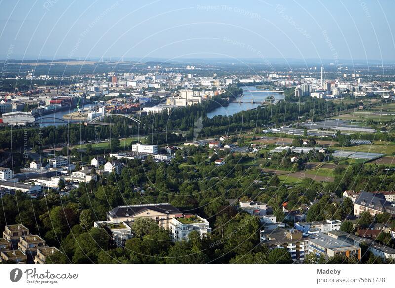 View of the Main, the Ostend and Fechenheim districts and Offenbach am Main from the viewing platform of the Henninger Turm in blue skies and sunshine Tower