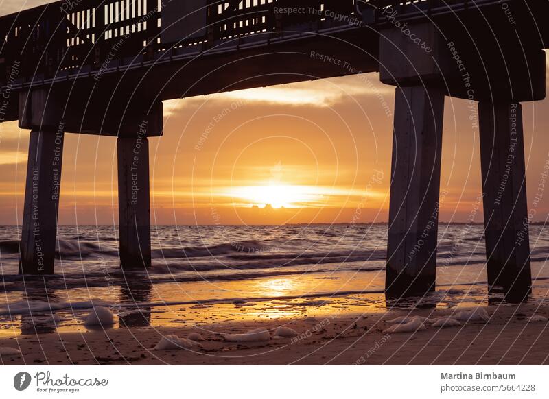 Sunset behind the pier of Fort Myers Beach, Florida USA fort myers beach florida landscape travel sunset ocean coast sky sea bridge silhouette orange beautiful