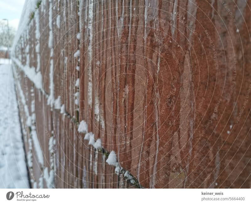 Water frozen to ice on a sandstone wall with snow Ice Frozen Snow Sandstone Stone icily Frost Building building damage frost protection frost damages