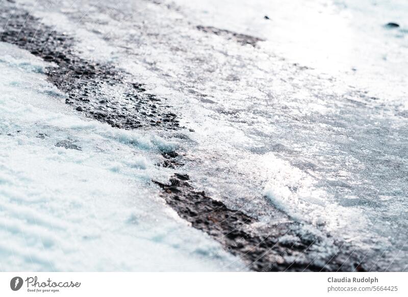 Black ice: Close-up of icy road surface on a sunny winter's day smooth road Danger of black ice Smoothness Ice Traffic infrastructure Winter Frost Snow Street