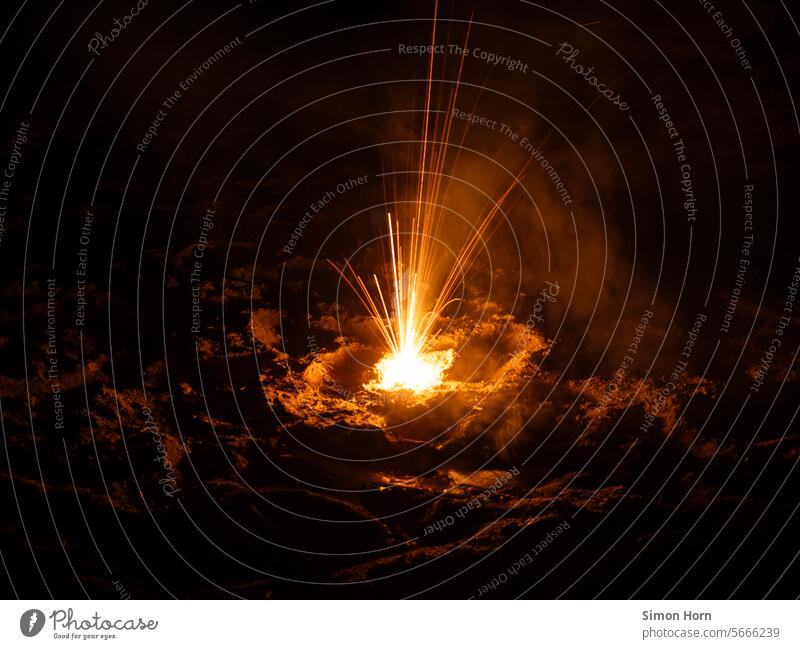 Fireworks spray sparks and light up the surrounding earth Explosion smoke Smoke Earth Spark Energy Hot Night Pyrotechnics Firecracker Effects Light