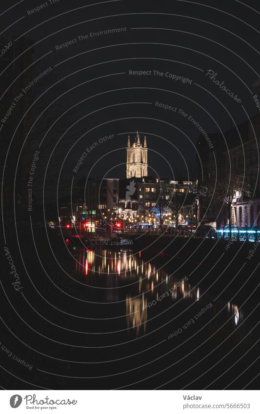 Evening city centre of Ghent in the Flanders region, Belgium. View of the Belfry of Ghent. The very famous towers that are landmarks of Gante heritage gent