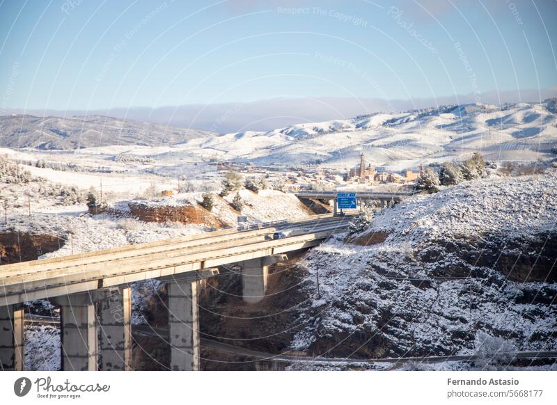 Snow. Winter landscape covered in a white blanket of snow covering mountains and roads. Trees with snow. Clear day. White blanket due to a storm with heavy snowfall. In Spain. January. 2024.