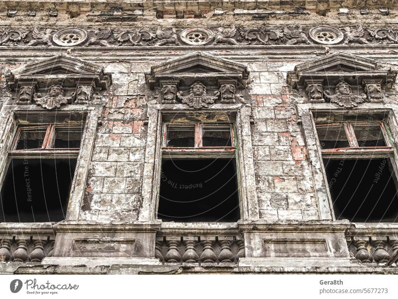 old abandoned house and tree in Ukraine Donetsk architecture blue bottom view branches brick building city conflict construction crisis damaged empty europe