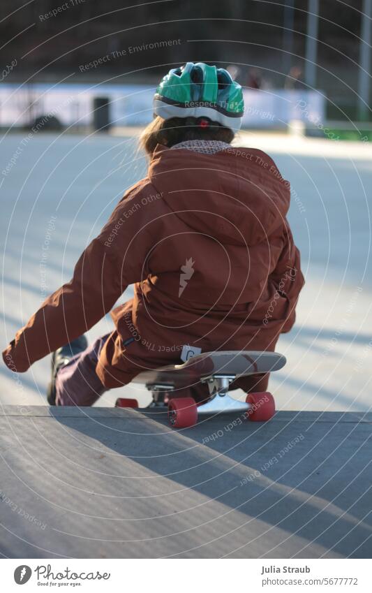 Surfskateboarding in a sitting position Child surfskateboard Skateboard Helmet Skate park fun seated out Cold Roll