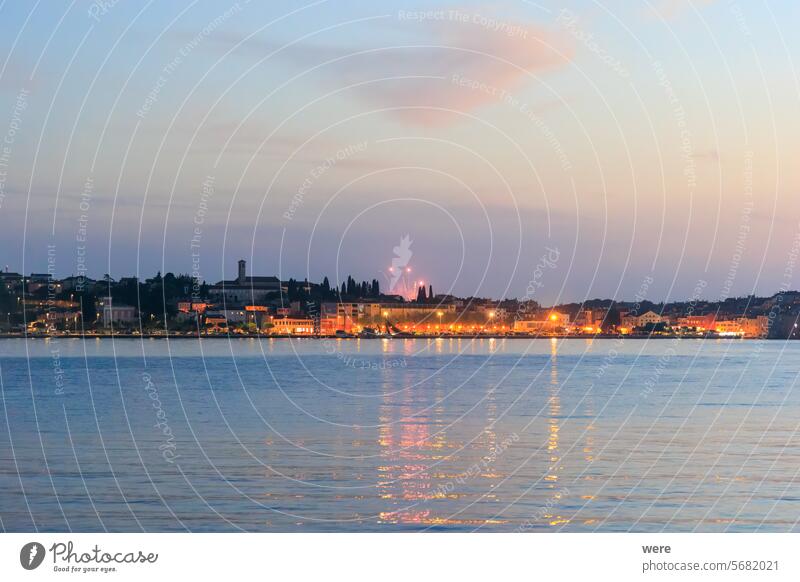 The old town of Rovinj with the church of St. Euphemia seen from the sea on a sunny day with blue sky Sea Water drip drowning fireworks historical humid ocean