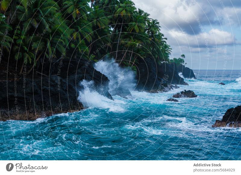 Waves crashing on the rugged Praia Jalé shoreline wave praia jalé turquoise ocean volcanic rock palm tree green lush moody sky nature coast tropical island