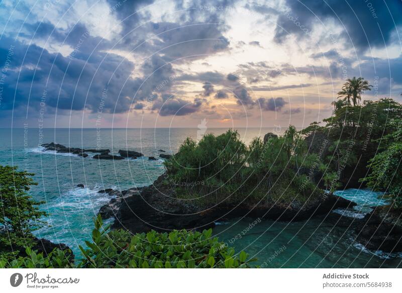 Scenic sunset view at South Coast Gombela south coast gombela tranquil coastline vegetation rocky outcrop lush peaceful seascape dusk evening sky