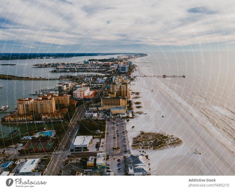 Aerial view of Miami coastline on a cloudy day miami florida usa aerial view drone shot beach buildings cloudy sky urban nature blend sandy water sea ocean