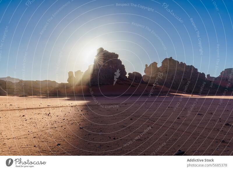 Sunset silhouettes against desert backdrop sunset sahara rock formation natural beauty sky algeria Tin Merzouga africa landscape nature dusk Tadrart Rouge