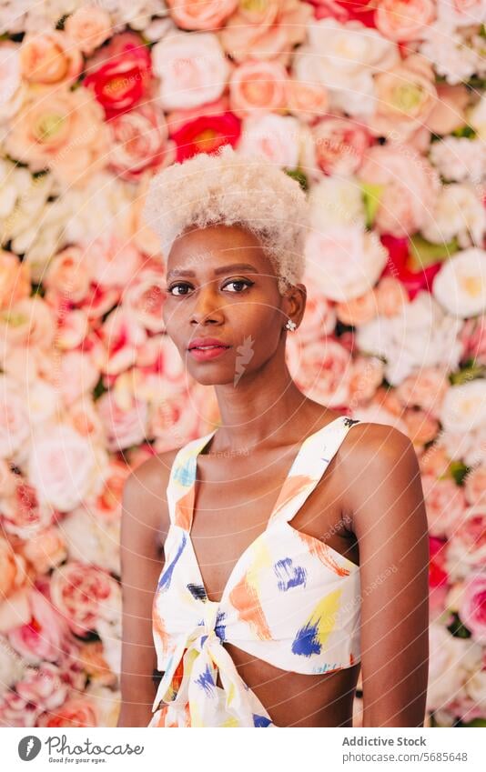 Stylish black woman with makeup flower appearance short hair style portrait elegant feminine queer hairstyle young charming fashion confident floral trendy