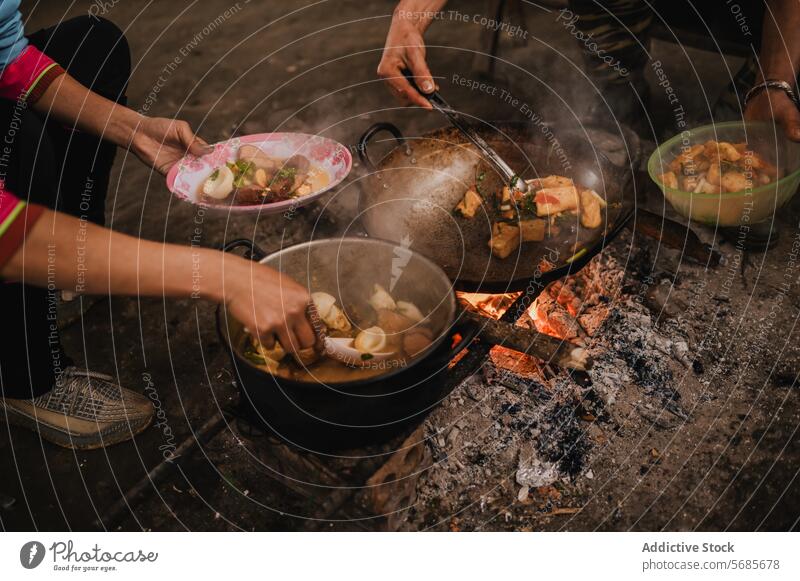 Concentrated Asian family prepare meal together indoors sit cook people tradition clothes food concentrate lunch home asian food oriental dish cuisine culture