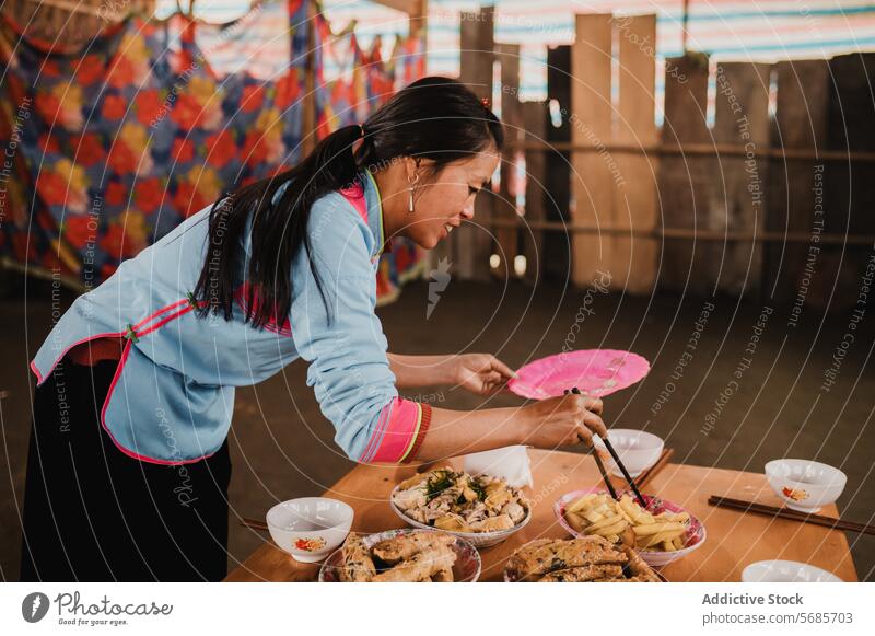 Cheerful woman setting table for lunch table setting serve food plate lady long hair porcelain bowl cheerful dishware holiday celebrate kitchen meal young