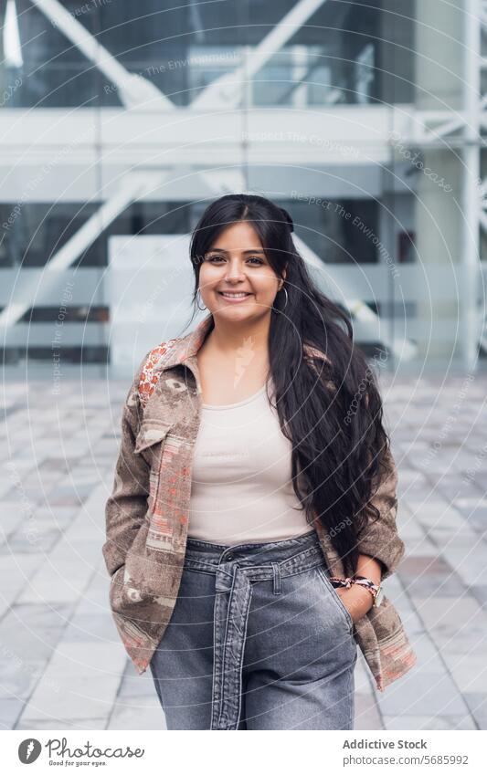 Stylish woman on street walk top curvy building modern smile style pants happy city urban outfit positive joy female sidewalk glad sun optimist stroll delight