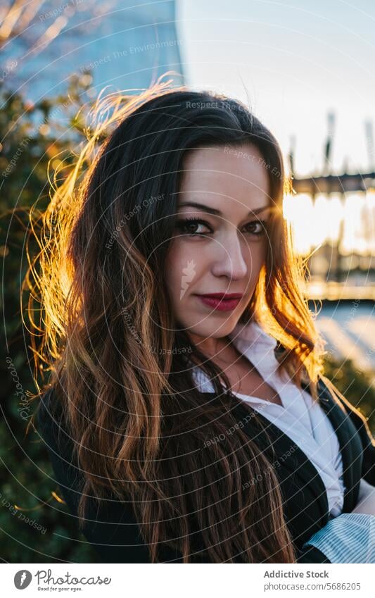 Evening glow on woman in Madrid madrid evening portrait young warm light setting sun pose feature accentuated female beauty dusk twilight golden hour backlit