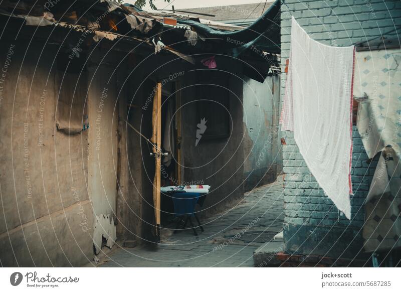 Laundry day in the farthest corner of the old town House (Residential Structure) Simple Old Authentic Old town Facade Shadow China Hutong Beijing Subdued colour