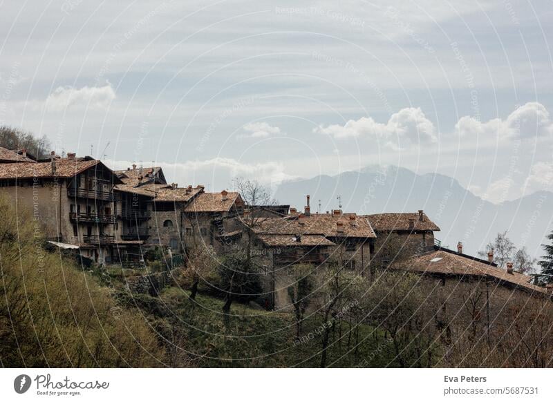 Canale di Tenno, medieval village in Italy Looking mountains Trentino Tourism vacation houses Haze trento Mountain Summer Landscape Nature Lake Sky Water