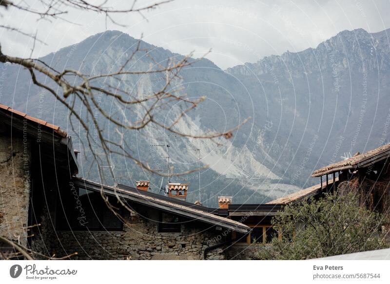 Canale di Tenno, medieval village in Italy Looking mountains Trentino Tourism vacation houses Haze trento Mountain Summer Landscape Nature Lake Sky Water