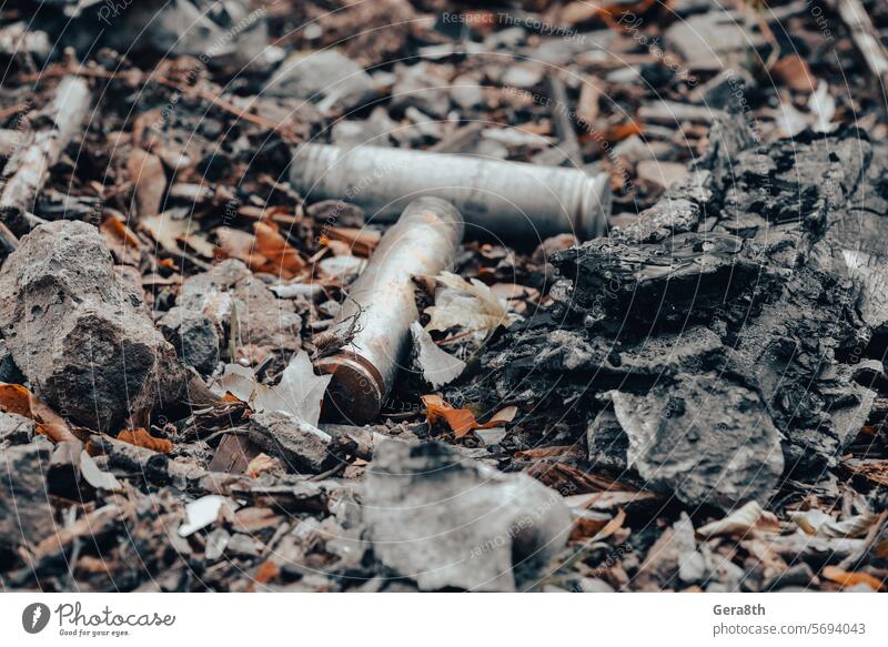 shell casings after a shooting battle in Ukraine Russia Ukrainian abandon abandoned army attack background blown up bombardment broken burned out caliber