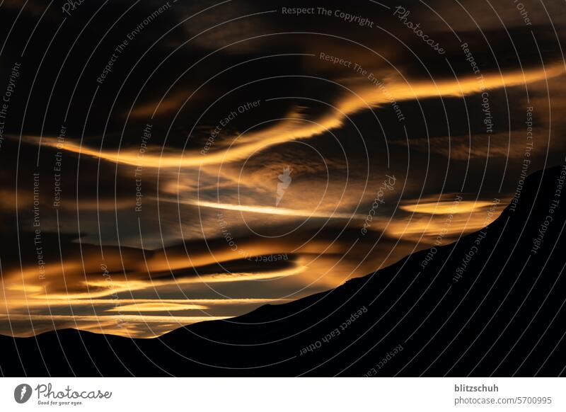 Sunset in the Swiss Alps with lee clouds sunset Leecloud Lee clouds Exterior shot Nature Landscape vacation Sunlight Freedom Winter sports Winter vacation