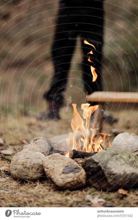 Campfire with dry wood in a stone circle in nature campfire Camp fire atmosphere Stone stones Meadow Nature Experiencing nature Love of nature Fire Fireplace