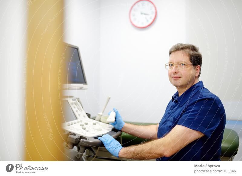 Portrait of oncologist mammologist doctor during appointment of patient. Doctor of ultrasound scanning during working in modern clinic. portrait checkup